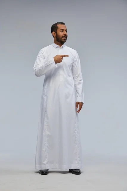 Saudi Man in White Thobe Pointing in Studio