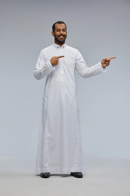 Saudi Man in White Thobe Pointing in Studio