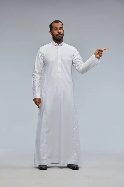 Saudi Man in White Thobe Pointing Finger in Studio