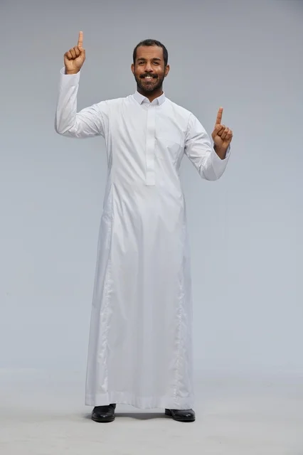 Saudi Man in White Thobe Pointing Up in Studio