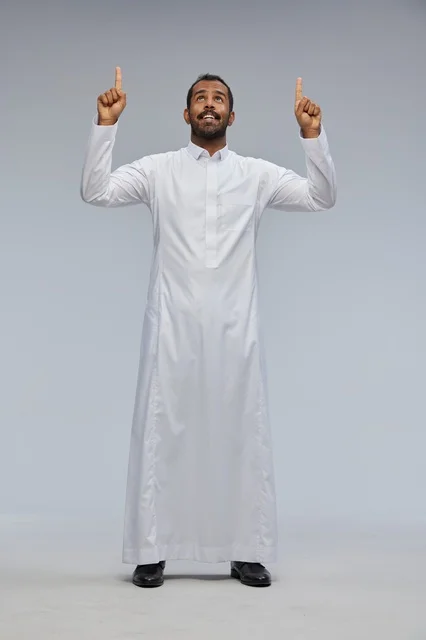 Saudi Man in White Thobe Pointing Upwards