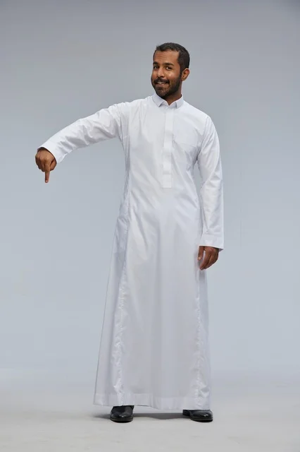 Saudi Man in White Thobe Pointing Downward Studio Shot