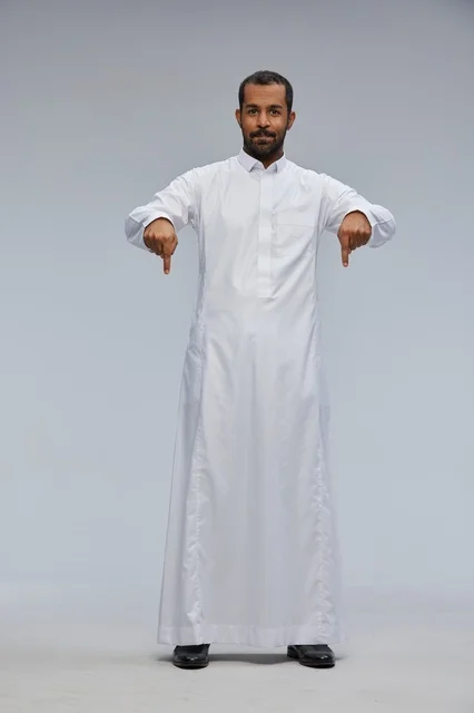 Full Length Saudi Man in White Thobe Pointing Down