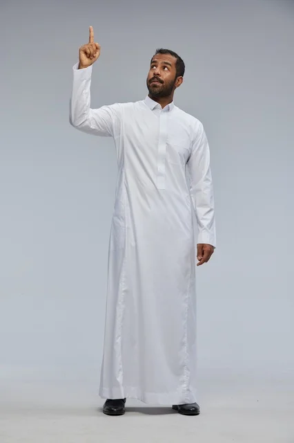 Saudi Man in White Thobe Pointing Upwards Studio Shot