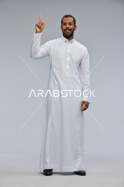 Saudi Man in White Thobe Pointing Finger Upward