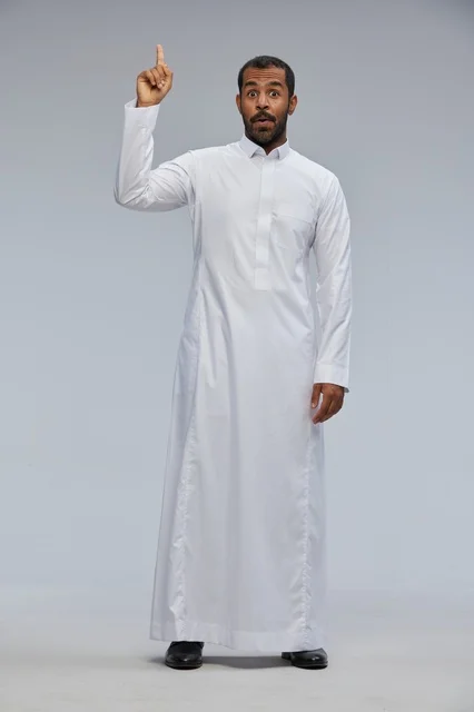 Saudi Man in White Thobe Pointing Up in Studio