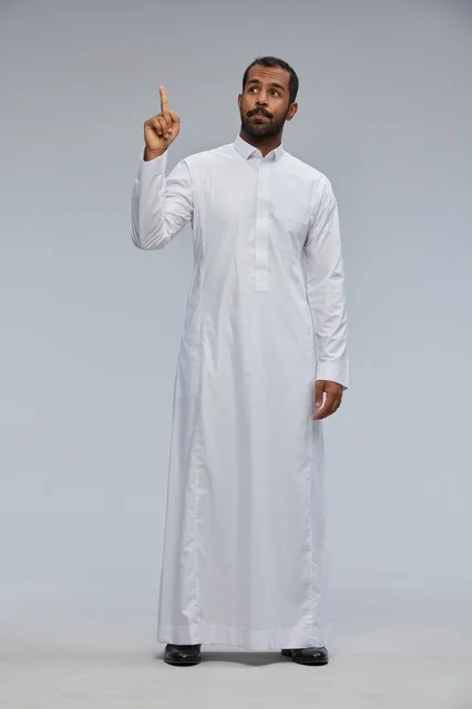 Saudi Man in White Thobe Pointing Upwards Studio Shot