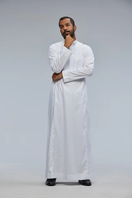 Saudi Man in White Thobe Thinking in Full Body Studio Shot