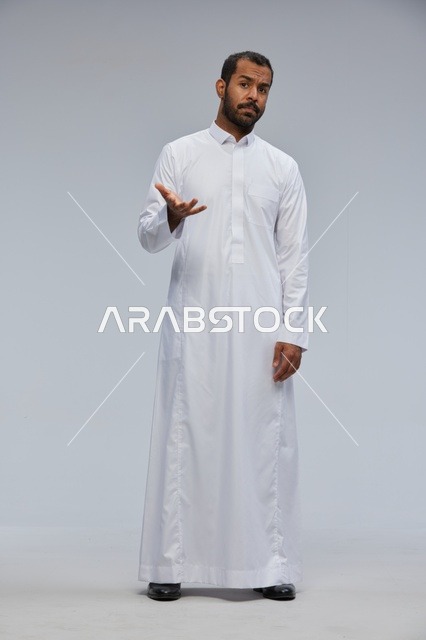 Saudi Man in White Thobe with Questioning Gesture