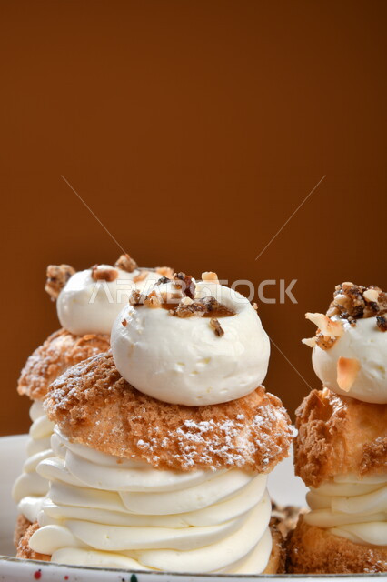 A plate of cold sweets decorated with cream, oriental sweets, Ramadan sweets, sweets and sugars, delicious sweets, sweets, delicious cold sweets