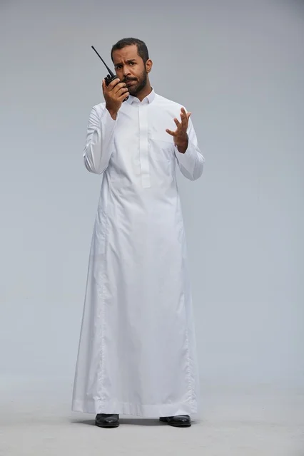 Saudi Man with Walkie Talkie in Traditional Thobe