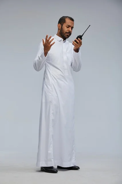 Saudi Man in White Thobe Using Walkie Talkie Studio
