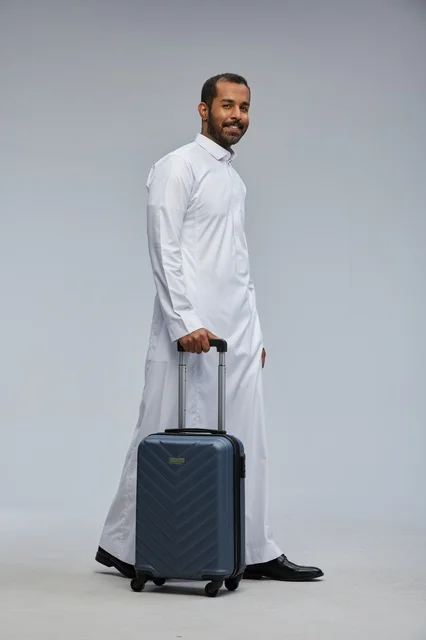 Saudi Man Traveler with Blue Suitcase in Studio