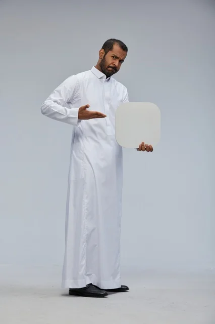 Saudi Man Holding Blank White Board in Traditional Thobe