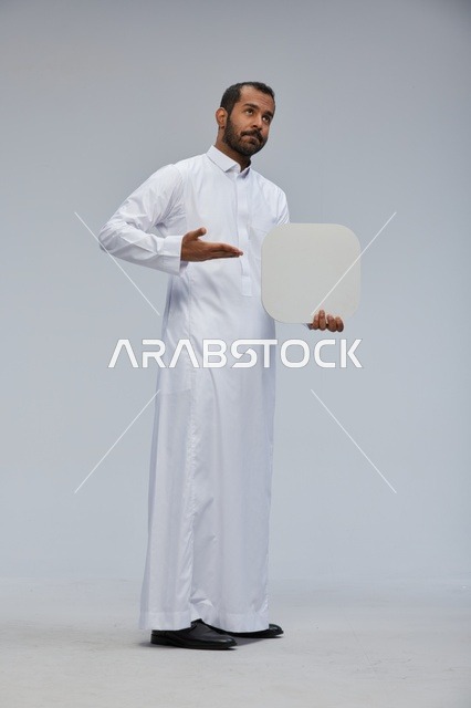 Saudi Man in White Thobe Holding Blank Mockup Board