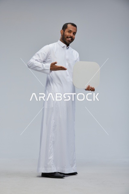 Saudi Man Holding Blank White Board in Studio
