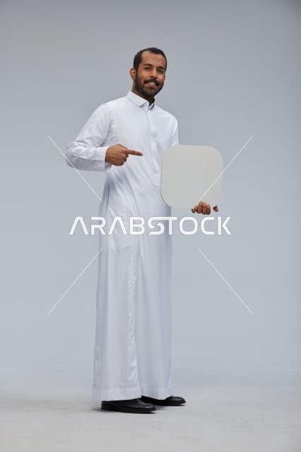 Saudi Man in Thobe Holding Blank White Board