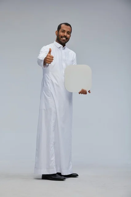 Saudi Man in Thobe Holding Blank White Board and Thumbs Up