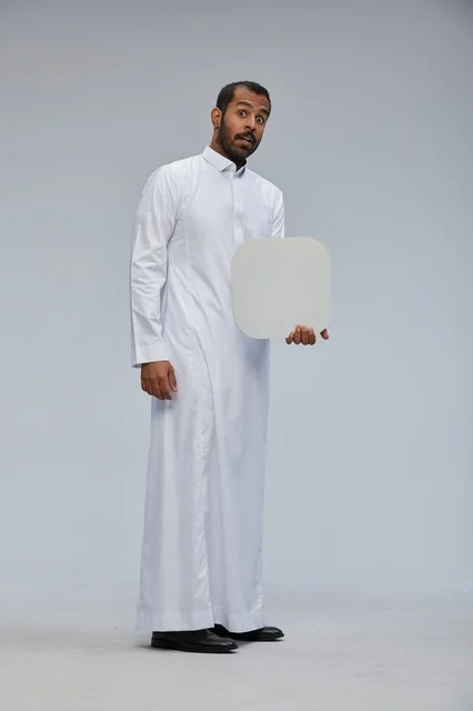 Saudi Man in Thobe Holding Blank White Board Sign