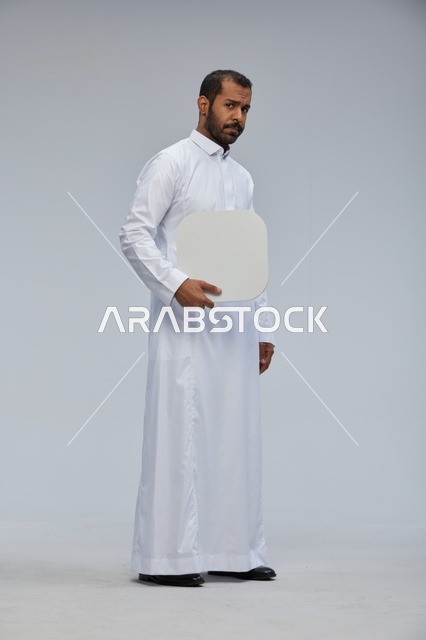 Saudi Man in Traditional Thobe Holding Blank White Sign