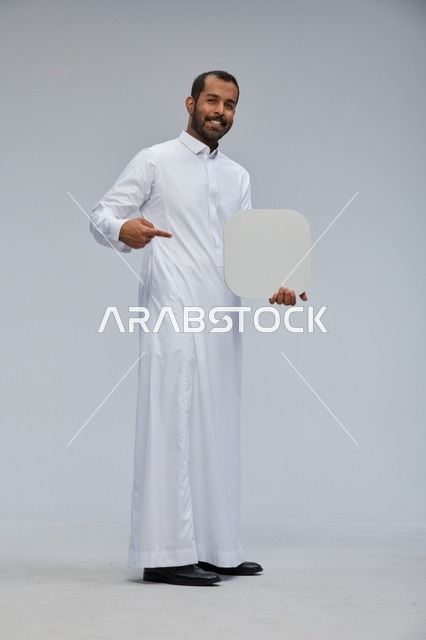 Saudi Man Holding and Pointing to Blank White Sign