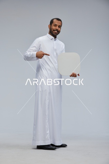 Saudi Man Holding Blank White Board in Studio