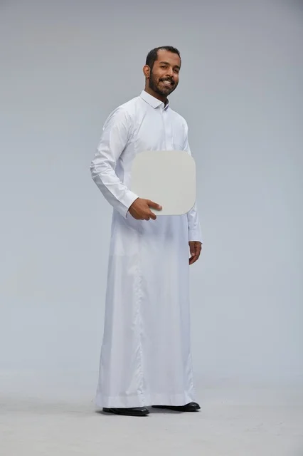 Saudi Man in Traditional Thobe Holding Blank Sign Board