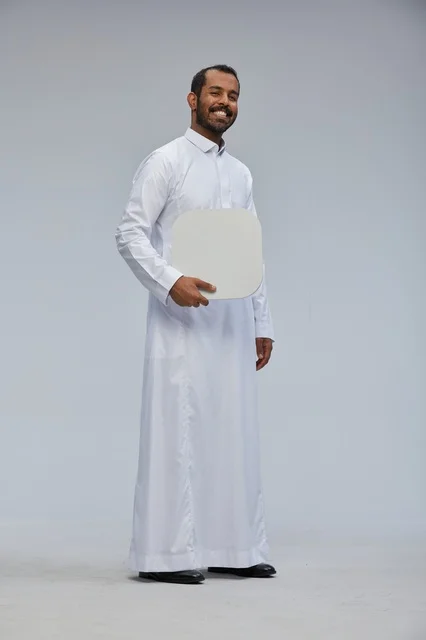 Saudi Man in White Thobe Holding Blank White Board