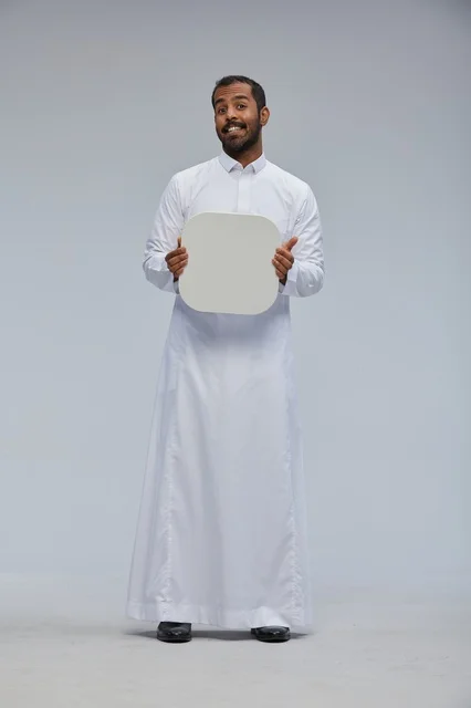 Saudi Man in Studio Holding Blank White Sign