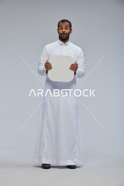Saudi Man in Thobe Holding Blank White Board