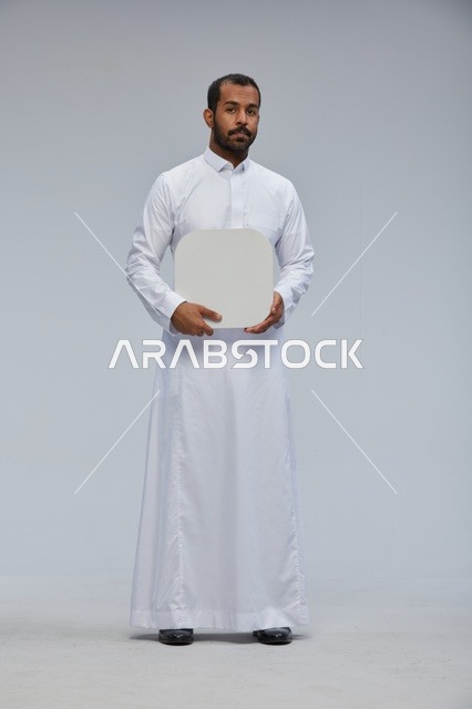 Saudi Arabian Man Holding Blank White Sign Board in Studio