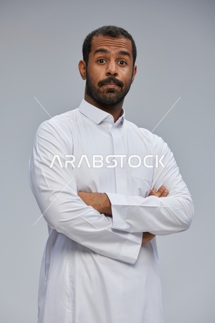 Saudi Man in White Thobe with Surprised Expression