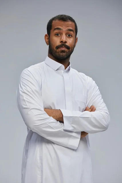 Saudi Man in White Thobe with Surprised Expression