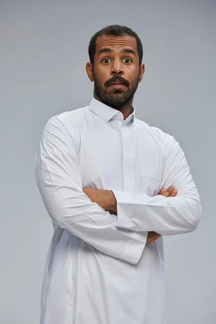 Surprised Saudi Man in White Thobe Studio Portrait