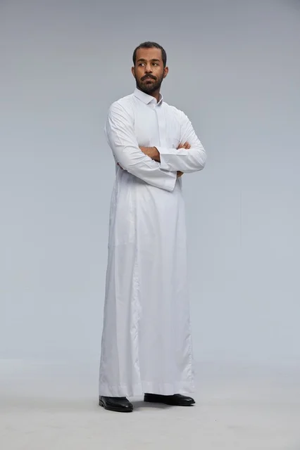 Saudi Man in White Thobe with Crossed Arms