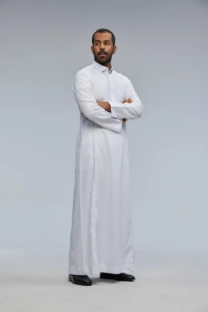Saudi Man in White Thobe with Arms Crossed