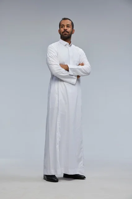 Saudi Man in White Thobe with Crossed Arms Studio