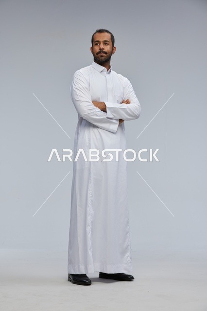 Saudi Man in White Thobe Standing Studio Portrait