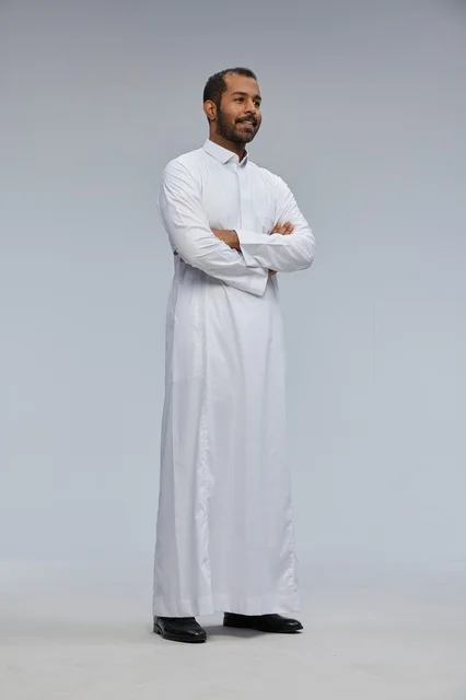 Saudi Man in White Thobe with Crossed Arms in Studio
