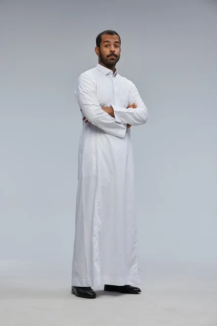 Saudi Man in White Thobe with Crossed Arms