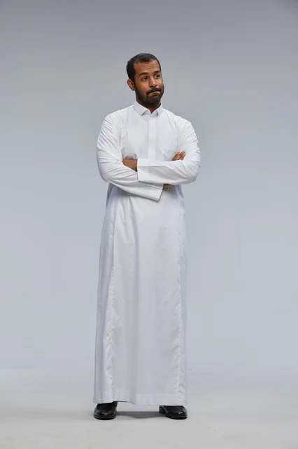 Saudi Man in White Thobe with Crossed Arms Portrait