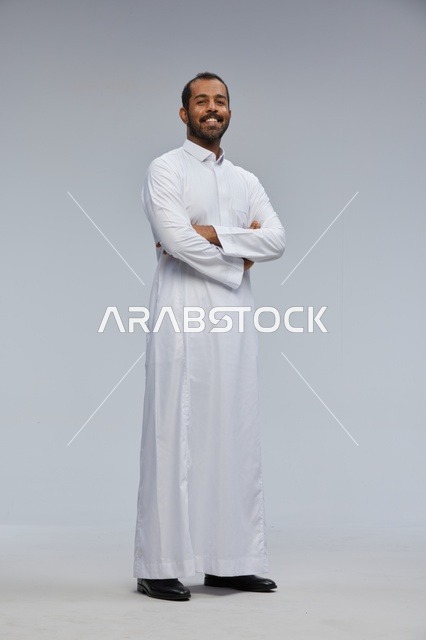 Saudi Man in White Thobe with Arms Crossed
