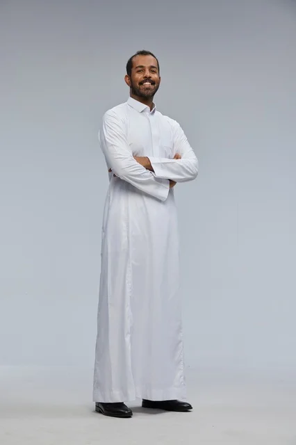 Saudi Man in White Thobe with Arms Crossed