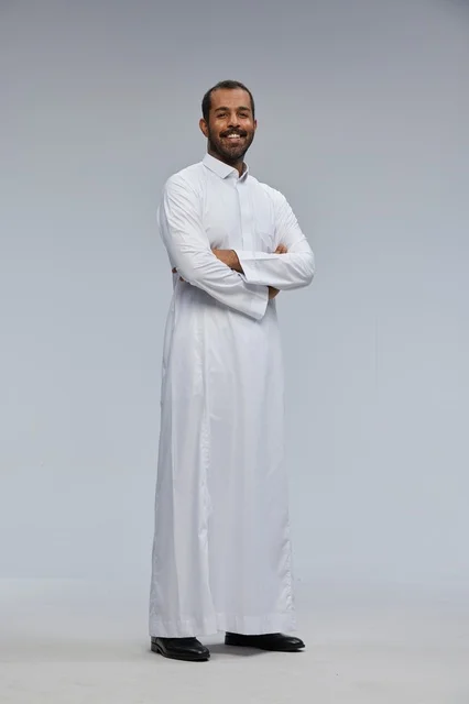 Saudi Man in White Thobe with Arms Crossed Standing