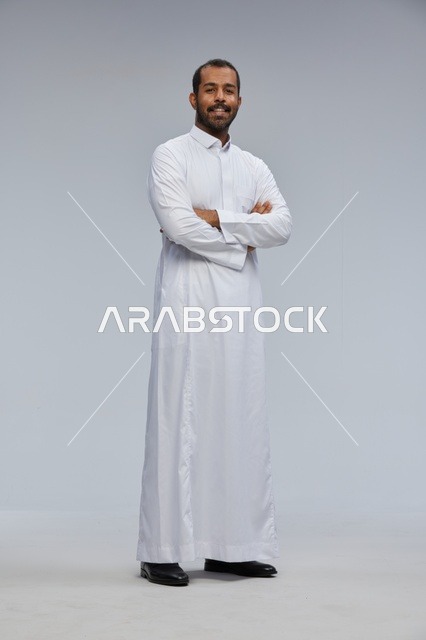 Saudi Man in White Thobe Standing in Studio Portrait