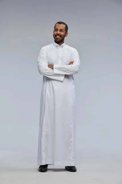 Saudi Man in Traditional White Thobe Standing in Studio