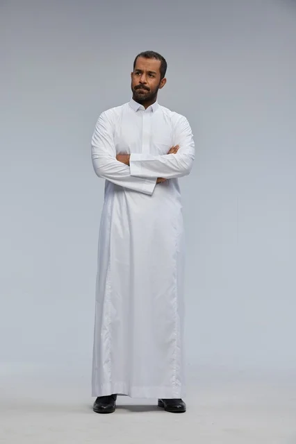 Saudi Man in White Thobe with Crossed Arms