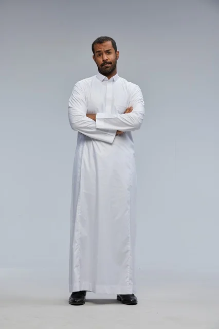 Saudi Man in White Thobe with Arms Crossed in Studio
