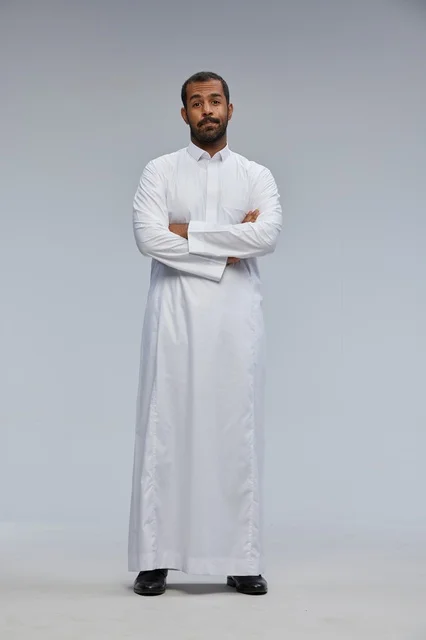 Saudi Man in White Thobe with Arms Crossed in Studio
