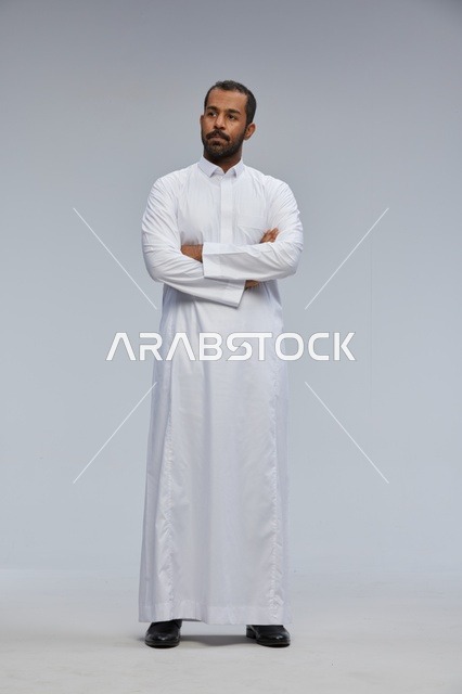 Saudi Man in White Thobe with Arms Crossed